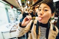 Backpacker eating delicious colorful rice ball