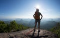 Backpacker enjoy the view on mountain top Royalty Free Stock Photo