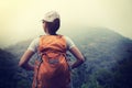 backpacker enjoying the view on morning mountain valley