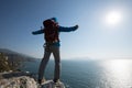 Backpacker enjoying the view on morning mountain