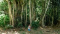 Backpacker exploring tropical jungle forest at Manadhoo island capital of Noonu atoll