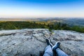 Backpacker at first lights of the day, Roche d Ajoux, Beaujolais, France Royalty Free Stock Photo