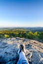 Backpacker at first lights of the day, Roche d Ajoux, Beaujolais, France Royalty Free Stock Photo