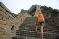 Backpacker hiking on the great wall Royalty Free Stock Photo