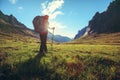 backpacker hiking in sunrise high altitude mountains Royalty Free Stock Photo