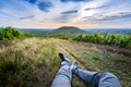 Backpacker legs at Mont Brouilly hill in vineyards, Beaujolais, France