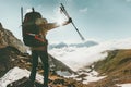 Backpacker Man on mountain summit Travel success Royalty Free Stock Photo