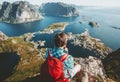 Backpacker man sitting on cliff edge relaxing Royalty Free Stock Photo