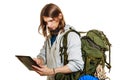 Backpacker man using pc tablet browsing internet. Royalty Free Stock Photo