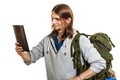 Backpacker man using pc tablet browsing internet. Royalty Free Stock Photo