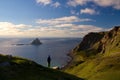 Backpacker on Matinden trail with Bleiksoya in background, Vesteralen, Norway