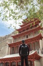 A Backpacker at Mogao Caves in Dunhuang, China