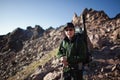 Backpacker in morning mountains Royalty Free Stock Photo