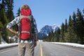 Backpacker on mountain road
