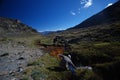 Backpacker in the outdoors filling water