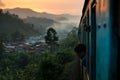 Backpacker looking at the train on the railway