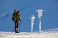 Backpacker posing in winter mountains