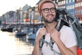 Backpacker smiling in the epic Nyhavn, Copenhagen, Denmark Royalty Free Stock Photo