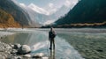 Traveler Admiring Himalayan Mountains By The River