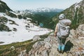 Backpacker tourist climbing mountain summit adventure Royalty Free Stock Photo