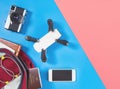 Backpacker travel gadgets and objects in Backpack top view flat lay on blue pink Royalty Free Stock Photo