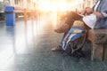 Backpacker at the train station with a traveler. Royalty Free Stock Photo