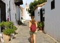 Backpacker visiting cozy small town of Betancuria in Spain