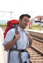 Backpacker waiting for his train Royalty Free Stock Photo