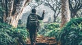 Hiker Ascends Lush Forest Path, Offering Peace Sign Royalty Free Stock Photo