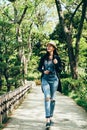 Backpacker walking in japanese garden Royalty Free Stock Photo