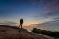 Backpacker watching a sunrise at Acadia National Park Royalty Free Stock Photo