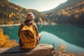 Backpacker woman with backpack enjoying the turquoise mountain lake. AI Generative