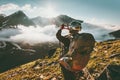 Backpacker woman hands showing heart shape enjoying mountains