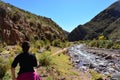 Backpacker woman hiking a trail in Bolivia