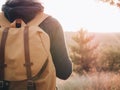 Backpacker woman on journey. Rear view of traveler woman. Royalty Free Stock Photo