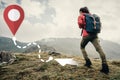 Backpacker woman going up on mountain to GPS route.