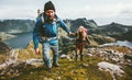 Backpackers Couple holding hands hiking in mountains Royalty Free Stock Photo