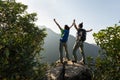 Backpackers enjoy the view on cliff edge Royalty Free Stock Photo