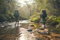 Backpackers exploring remote and untouched natural settings. They walk across the river.