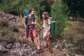 Backpackers hiking on the path in mountains Royalty Free Stock Photo