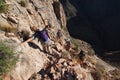 Backpackers on a steep, narrow trail in the Grand Canyon.