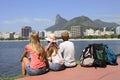 Backpackers tourists in Rio de Janeiro looking at Christ the Redeemer.