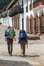 Backpackers walk through Villa de Leyva