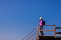 Backpacking asian woman hands holding a glass of warm coffee in the morning at outdoor,Camping hiking concept Royalty Free Stock Photo