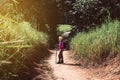 Backpacking asian woman walking with trekking pole in the morning at outdoor,Camping hiking concept Royalty Free Stock Photo