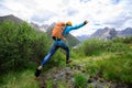 Backpacking woman jumping