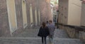 backs couple moving down stairs in the city They move around the city.