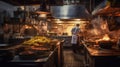 Backside of Chef cooking in a busy restaurant kitchen