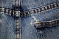 Backside of jeans with hole in pocket Royalty Free Stock Photo