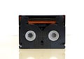 Backside of Mini DV video cassette - tape, isolated on white background. Vintage video recording technology from 1990s.